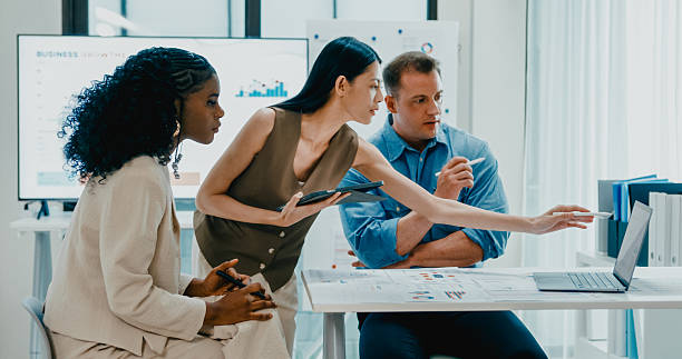 Goldbeta team collaborating on trading strategy in a modern office